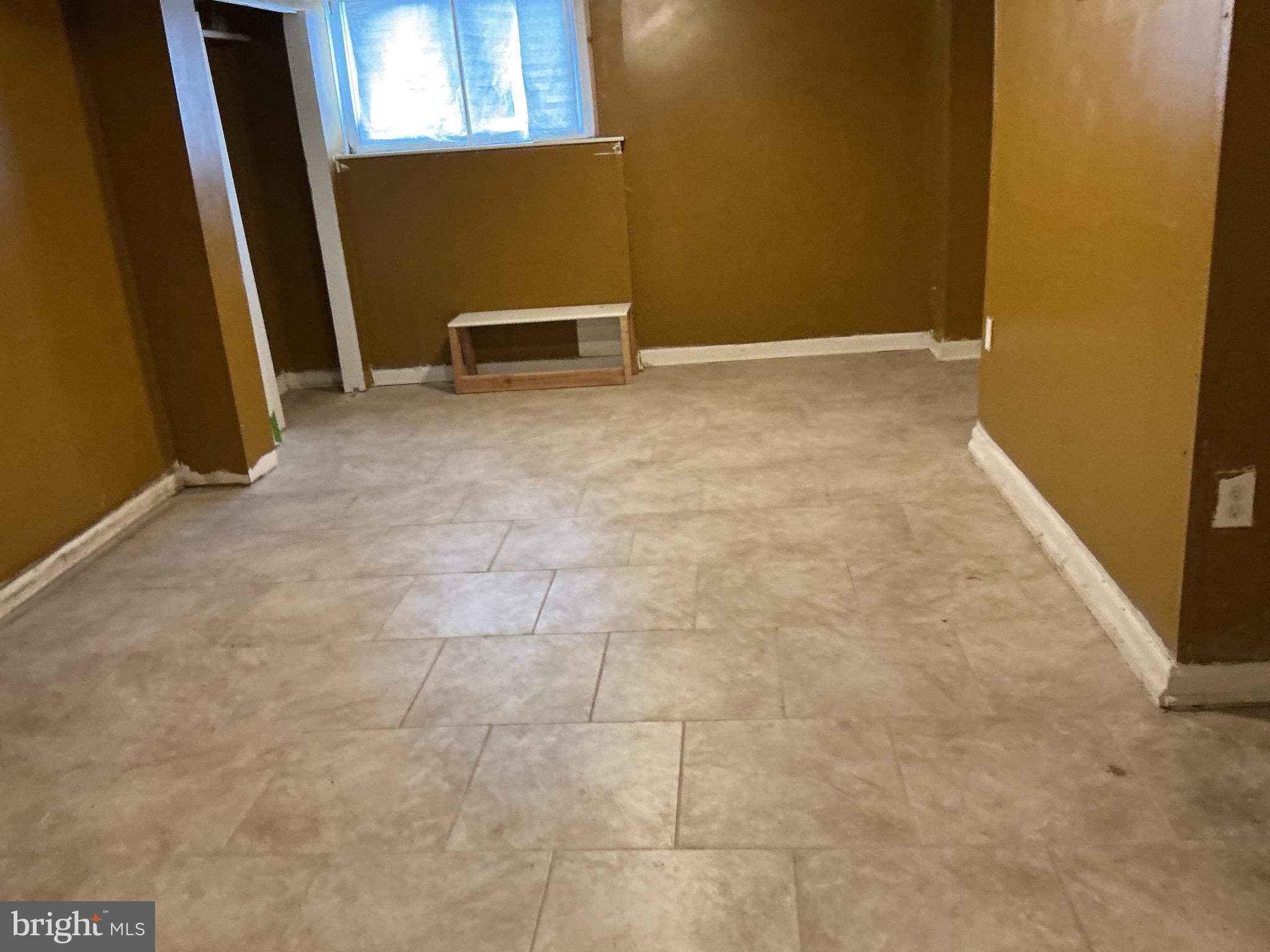 5010 Belair Road Baltimore, MD 21206 - Photo 9 of 24 a view of an empty room with windows