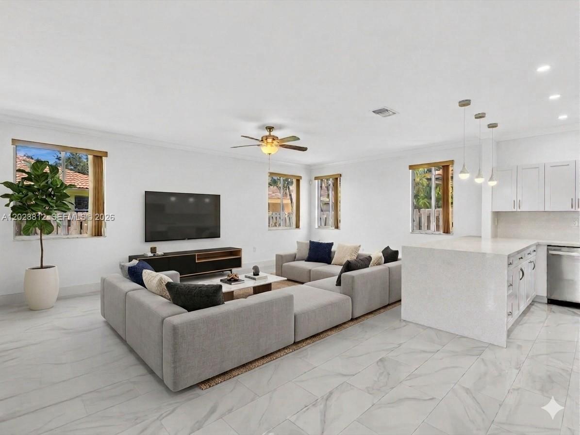 2864 Southwest 138th Path Miami, FL 33175 - Photo 13 of 40 a living room with furniture and a flat screen tv