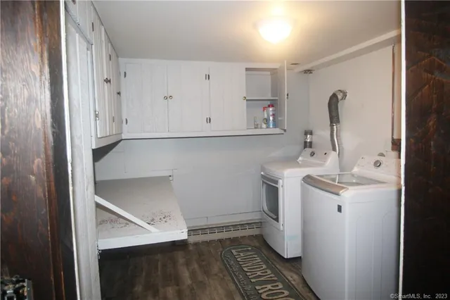 a bathroom with a sink and mirror with toilet