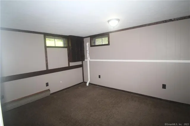 a view of an empty room with windows