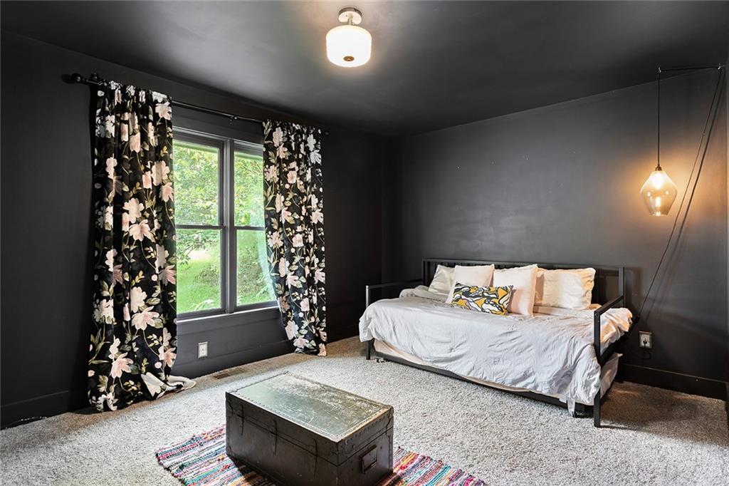 2280 Larchwood Road Southwest Atlanta, GA 30310 - Photo 12 of 20 a bedroom with a bed and a window