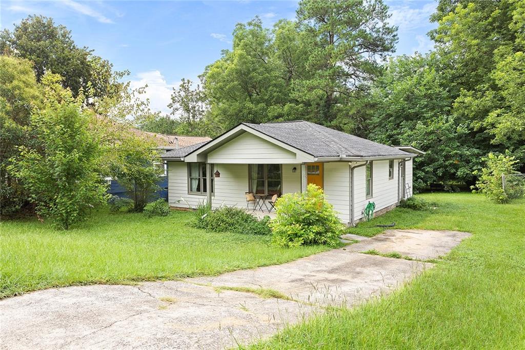 2280 Larchwood Road Southwest Atlanta, GA 30310 - Photo 20 of 20 a front view of a house with garden
