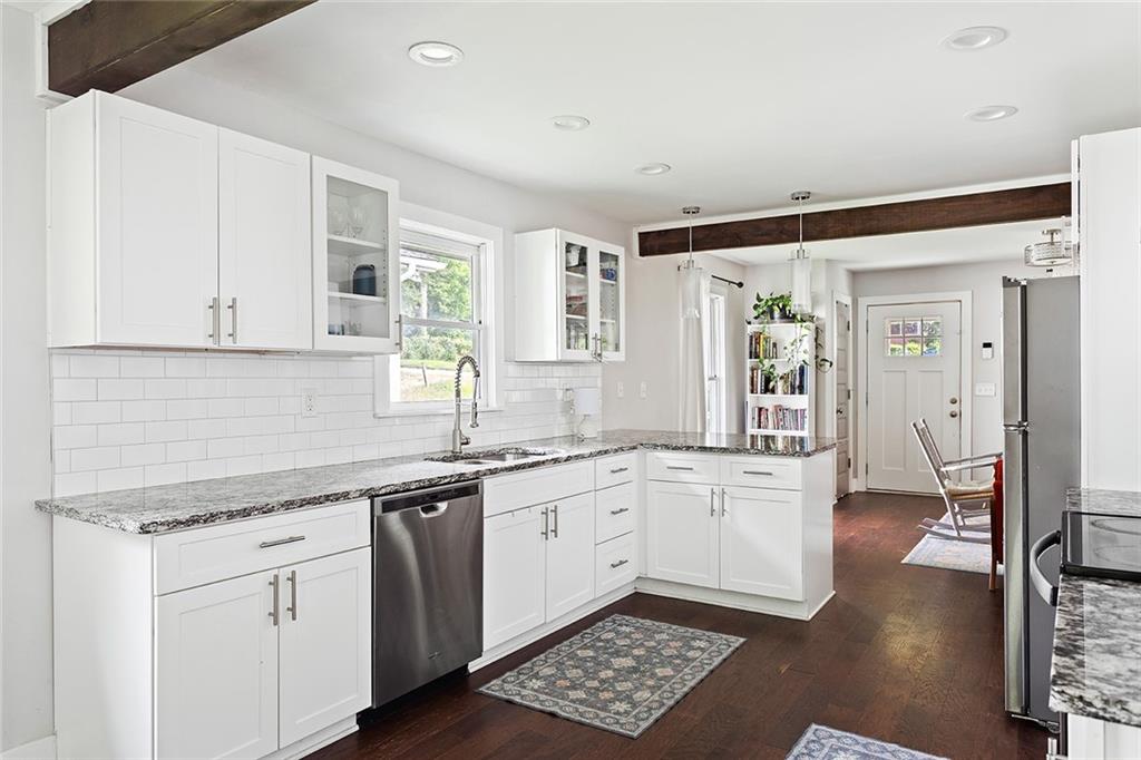 2280 Larchwood Road Southwest Atlanta, GA 30310 - Photo 7 of 20 a kitchen with a sink stove and cabinets