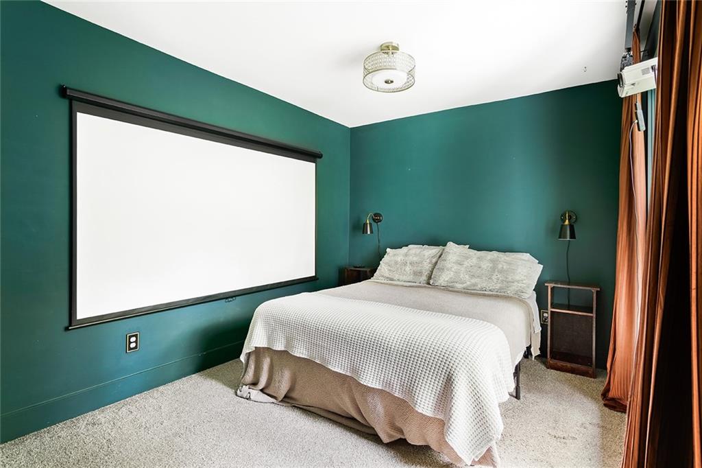 2280 Larchwood Road Southwest Atlanta, GA 30310 - Photo 9 of 20 a bedroom with a large bed and a window