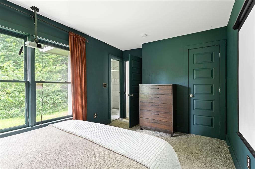 2280 Larchwood Road Southwest Atlanta, GA 30310 - Photo 10 of 20 a bedroom with a bed and a window