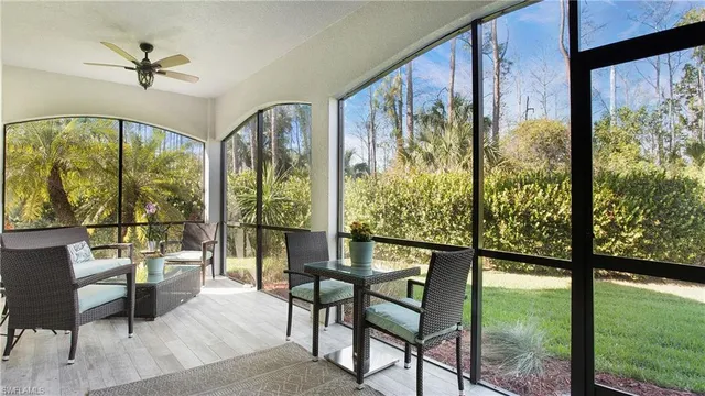 a living room with large windows