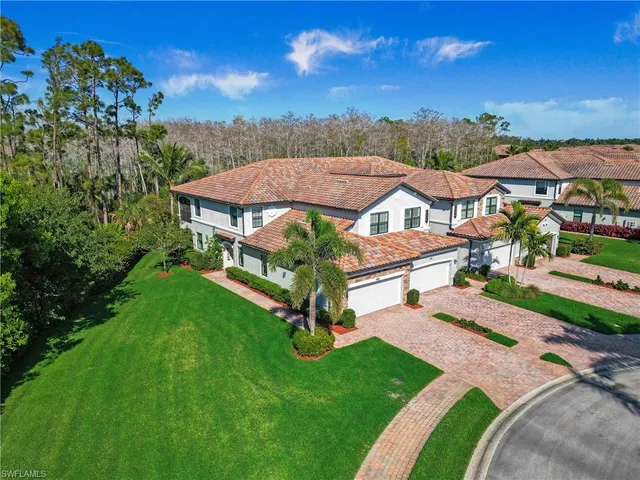 a view of a garden with lawn chairs