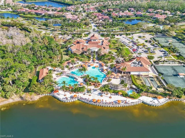 an aerial view of residential houses with outdoor space and street view