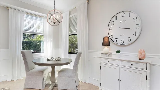 a view of a dining area with furniture window and a mirror