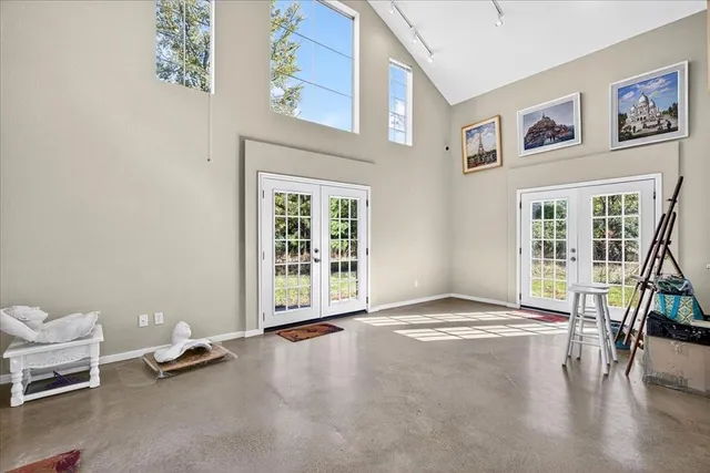 a view of livingroom with furniture and floor to ceiling window
