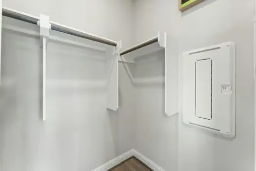 a en suite bathroom with a granite countertop sink and a mirror