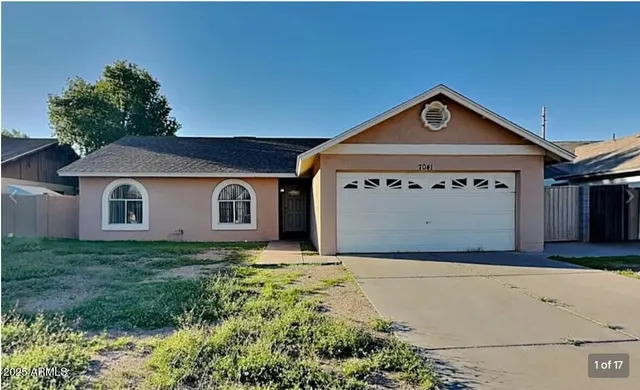 a front view of a house with yard