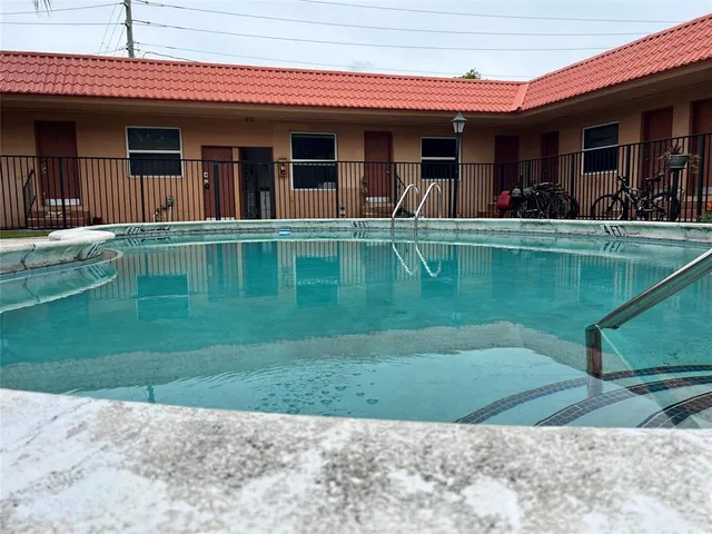 a view of a house with a swimming pool
