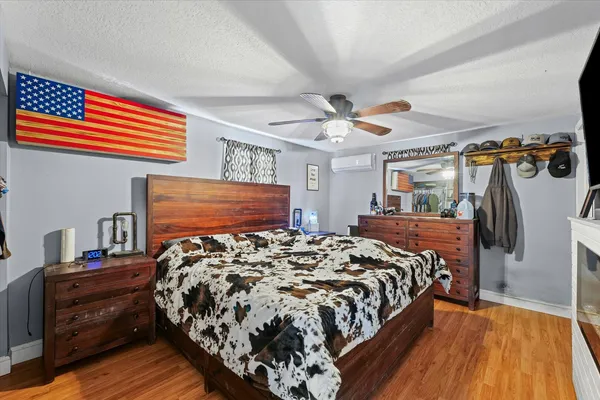 a bed sitting in a bedroom next to a window