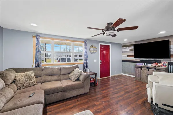 a living room with furniture and a flat screen tv