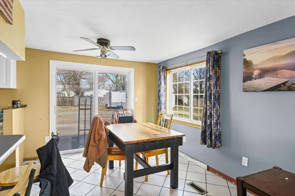 a view of a dining room with furniture window and outside view