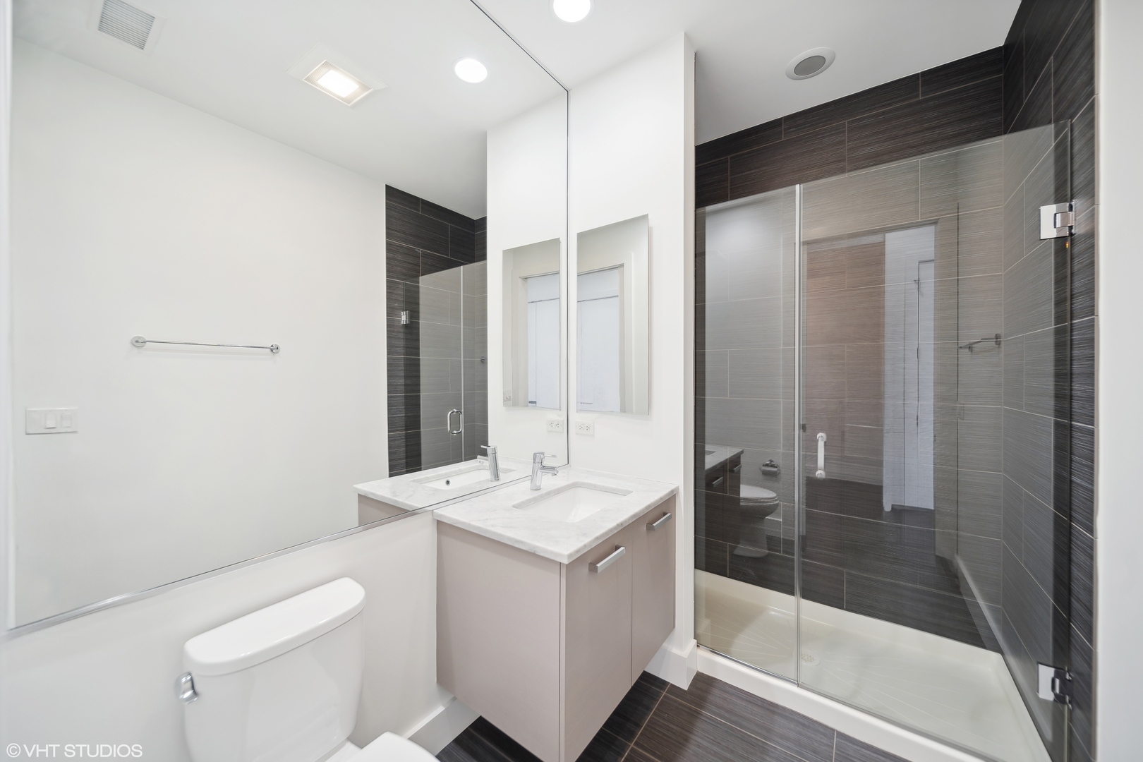 1100 West Adams Street, Unit 4S Chicago, IL 60607 - Photo 13 of 21 a bathroom with a sink a toilet and shower