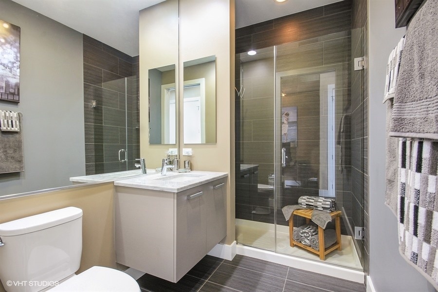 1100 West Adams Street, Unit 4S Chicago, IL 60607 - Photo 14 of 21 a bathroom with a sink toilet and shower