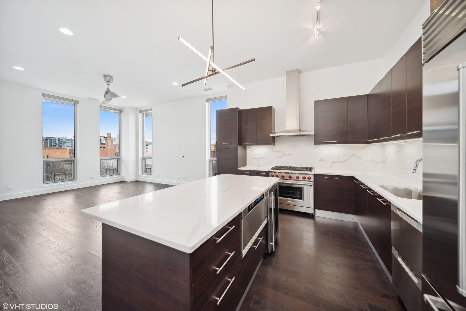 1100 West Adams Street, Unit 4S Chicago, IL 60607 - Photo 2 of 21 a kitchen with stainless steel appliances sink stove refrigerator and cabinets