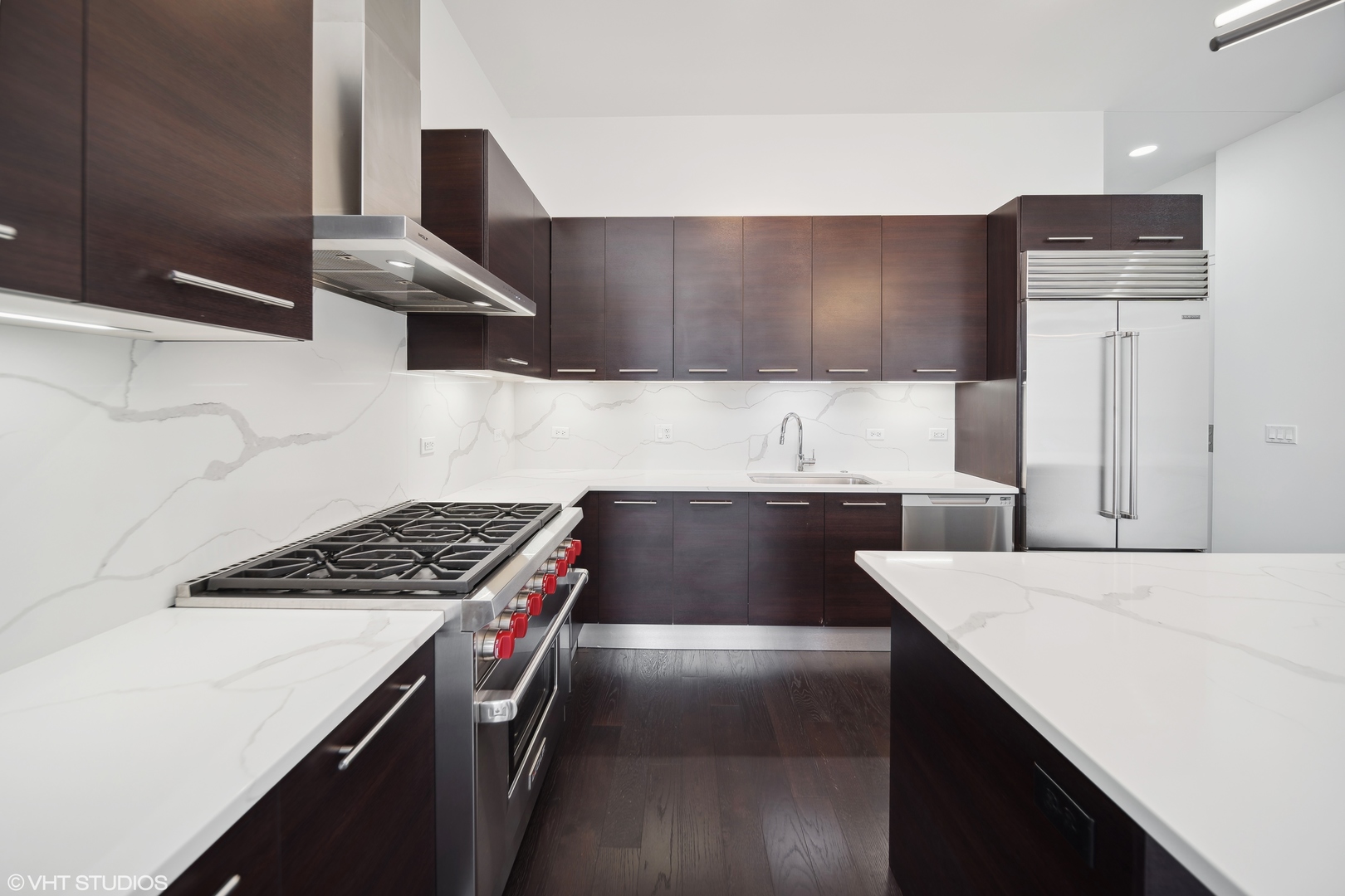 1100 West Adams Street, Unit 4S Chicago, IL 60607 - Photo 5 of 21 a kitchen with a sink a stove and a refrigerator