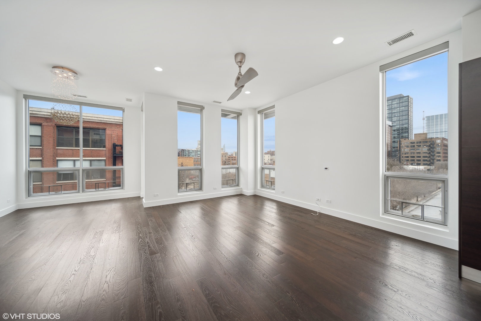 1100 West Adams Street, Unit 4S Chicago, IL 60607 - Photo 6 of 21 a view of an empty room with a window and wooden floor