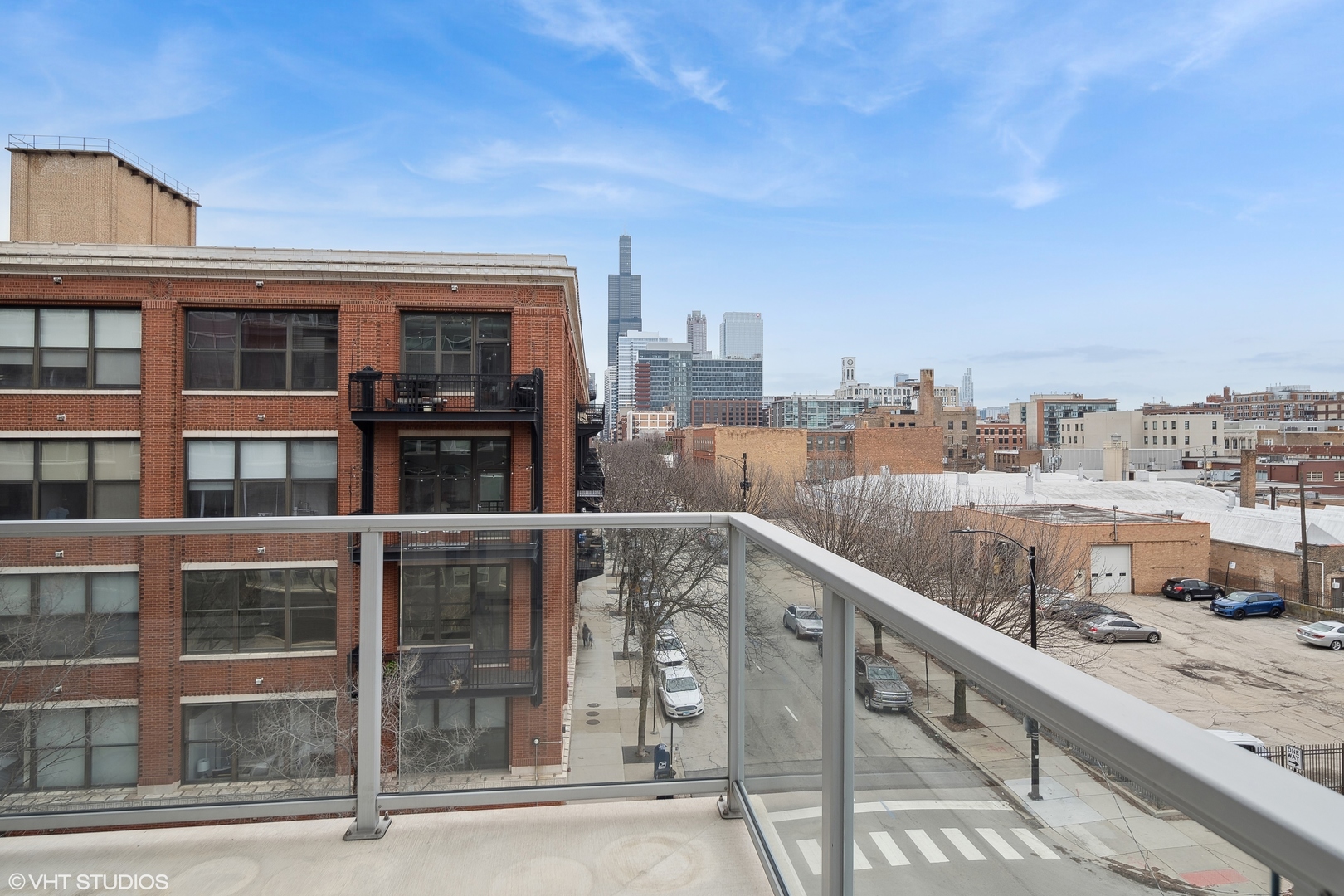 1100 West Adams Street, Unit 4S Chicago, IL 60607 - Photo 9 of 21 a city view from a balcony