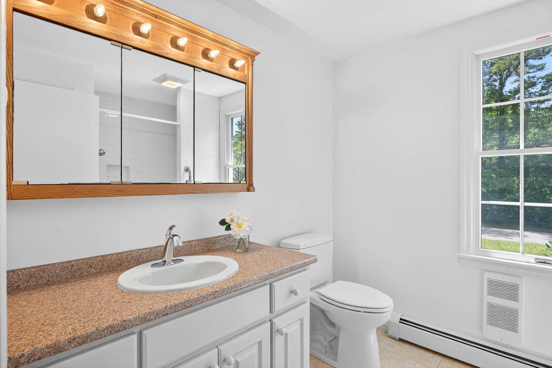 510 Hay Road Eastham, MA 02642 - Photo 12 of 34 a bathroom with a toilet sink and mirror