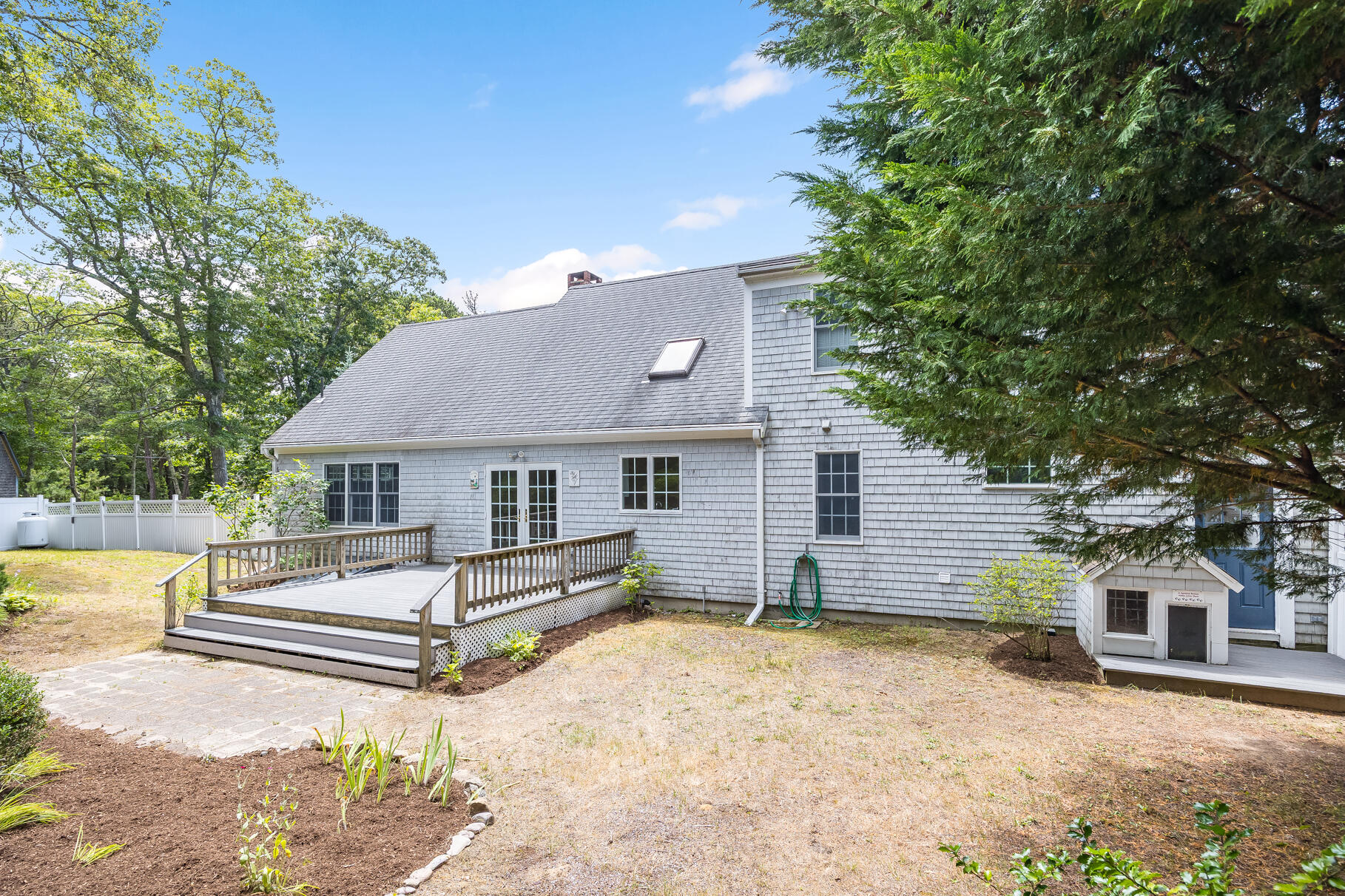 510 Hay Road Eastham, MA 02642 - Photo 21 of 34 a view of a house with a yard and large tree