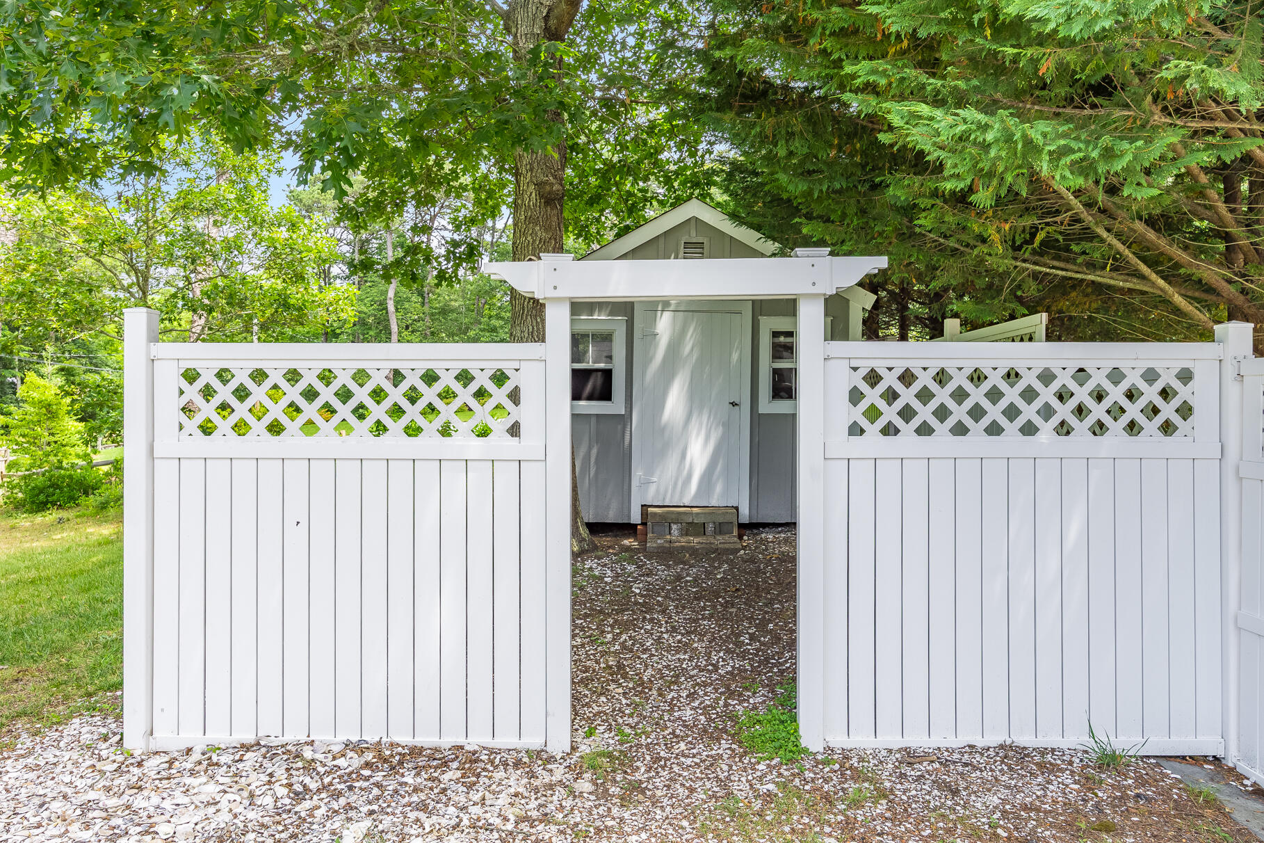 510 Hay Road Eastham, MA 02642 - Photo 23 of 34 a front view of a house with a fence
