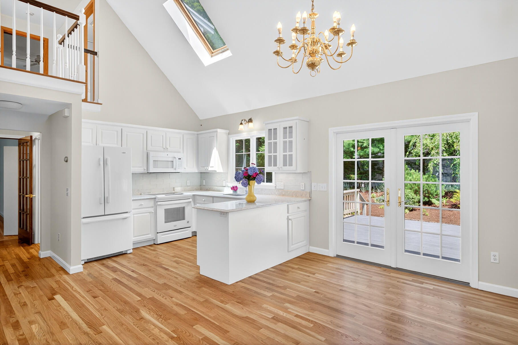 510 Hay Road Eastham, MA 02642 - Photo 5 of 34 a kitchen with stainless steel appliances a white stove top oven and a refrigerator