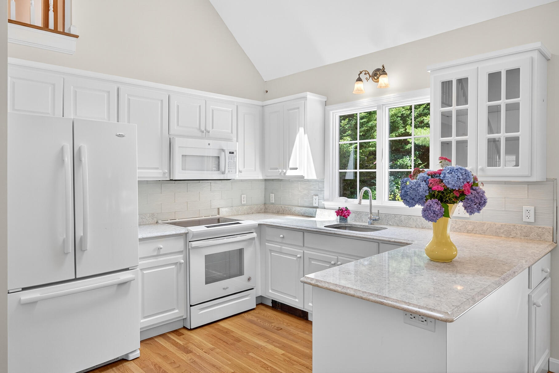 510 Hay Road Eastham, MA 02642 - Photo 7 of 34 a kitchen with a sink cabinets and window