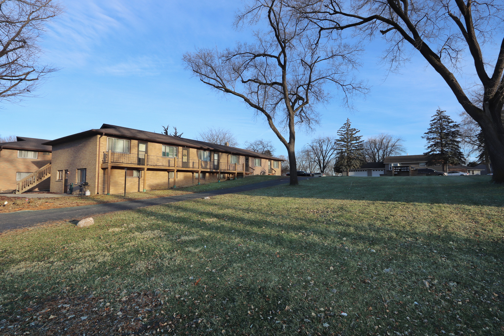 322 Maple Drive, Unit 2B Morris, IL 60450 - Photo 13 of 13 a view of a house with a yard