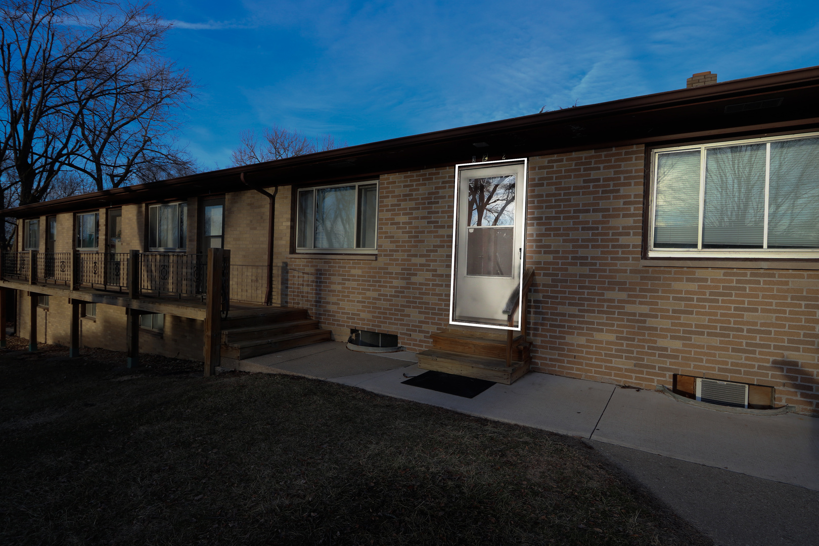 322 Maple Drive, Unit 2B Morris, IL 60450 - Photo 2 of 13 a front view of a house with a yard