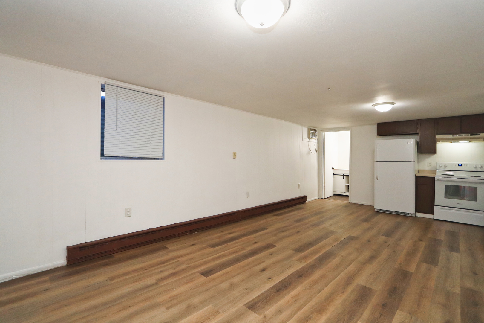 322 Maple Drive, Unit 2B Morris, IL 60450 - Photo 3 of 13 a view of empty room with wooden floor and window