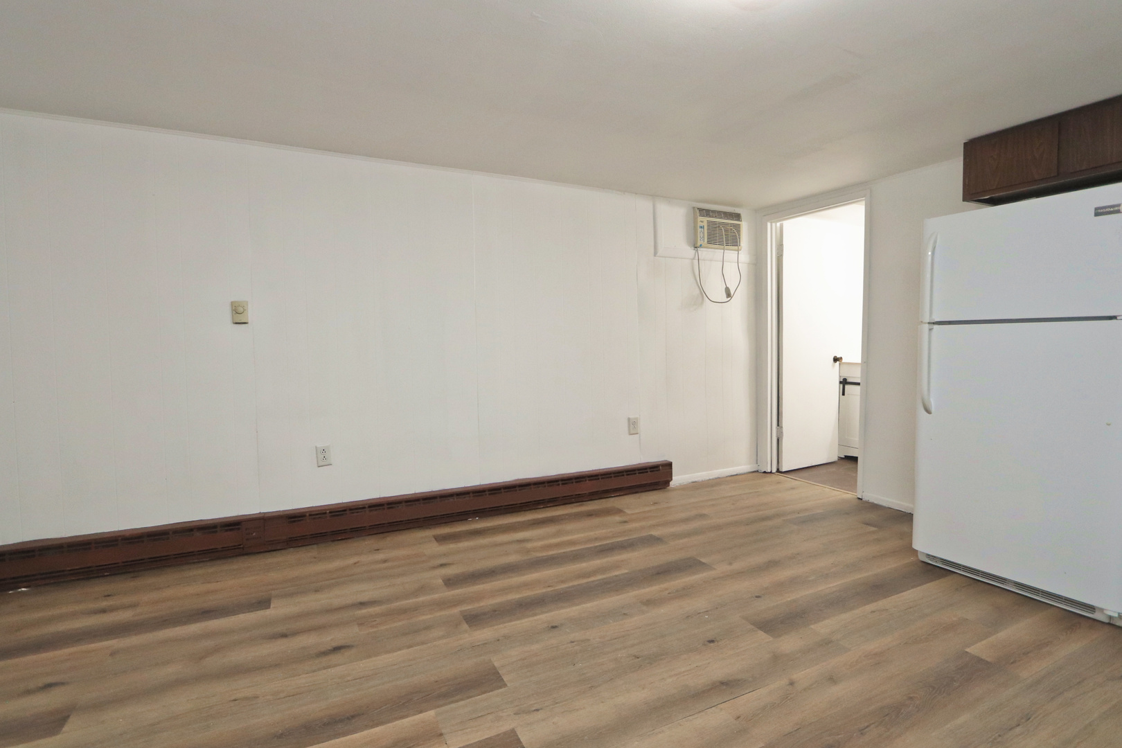 322 Maple Drive, Unit 2B Morris, IL 60450 - Photo 10 of 13 a view of an empty room with wooden floor