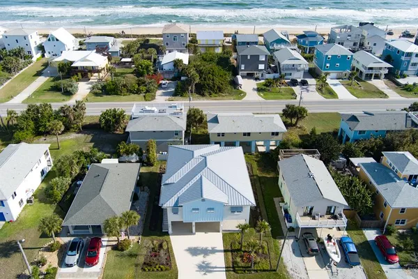 an aerial view of houses with outdoor space