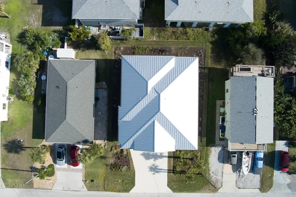 an aerial view of houses with outdoor space