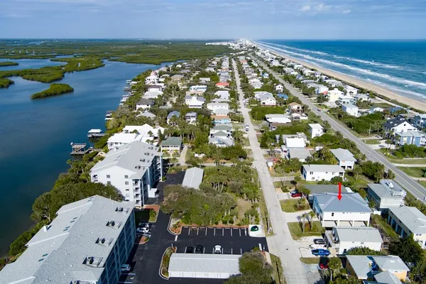 an aerial view of residential houses with outdoor space