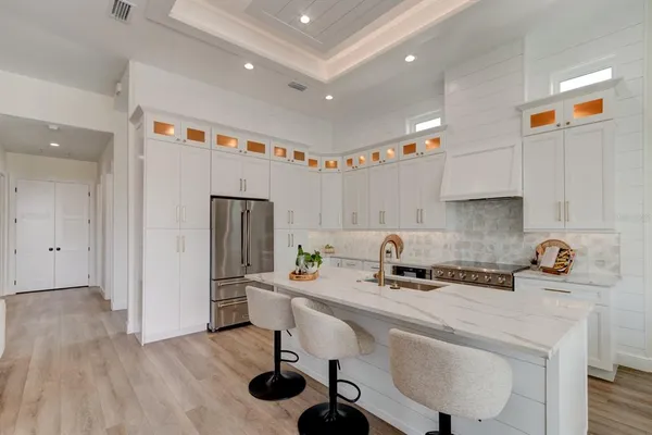 a kitchen with a sink cabinets and window