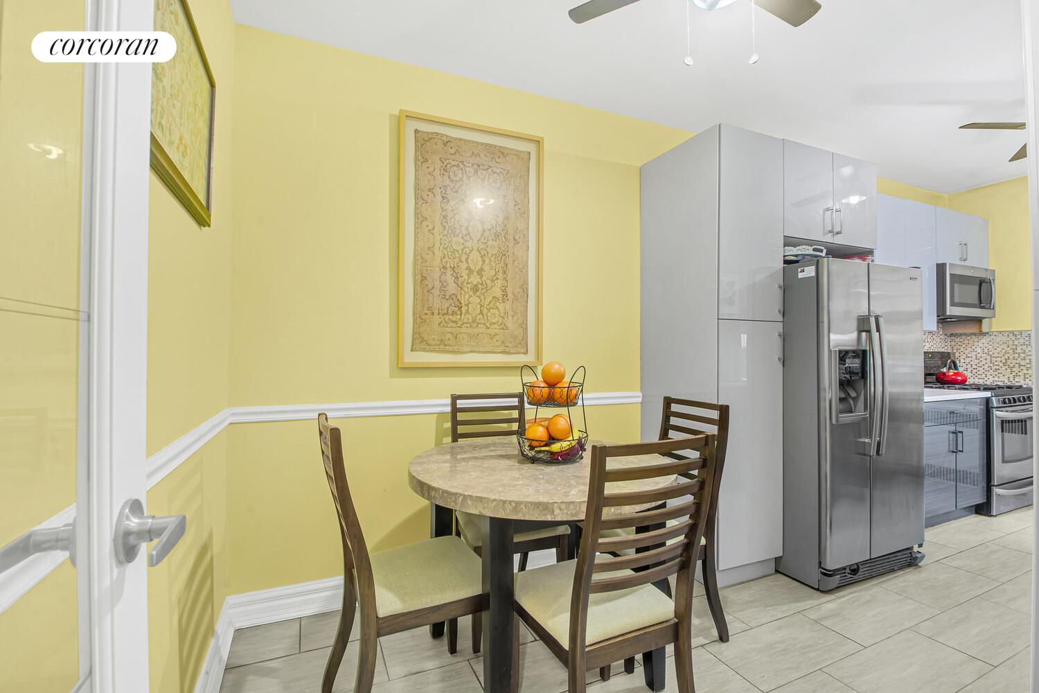 117-01 Park Lane South, Unit A6D Queens, NY 11418 - Photo 5 of 8 a view of a dining area with furniture and a window