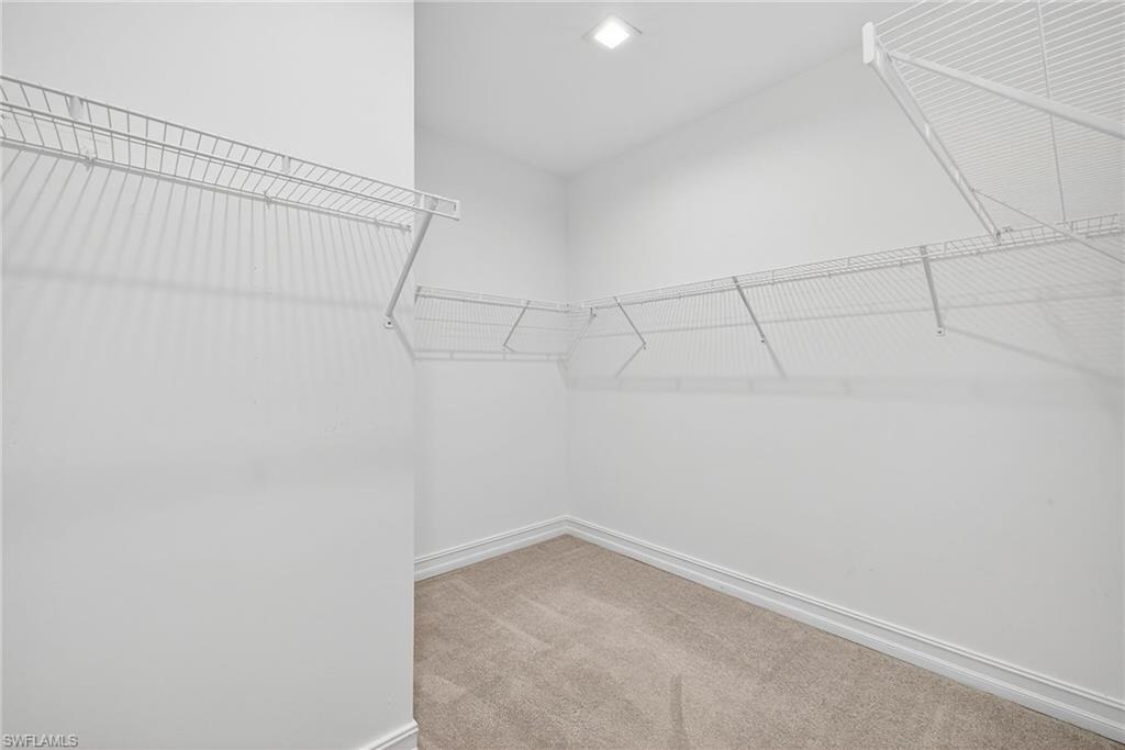 7570 Rockefeller Drive Naples, FL 34119 - Photo 25 of 34 a view of a room with racks on the wall