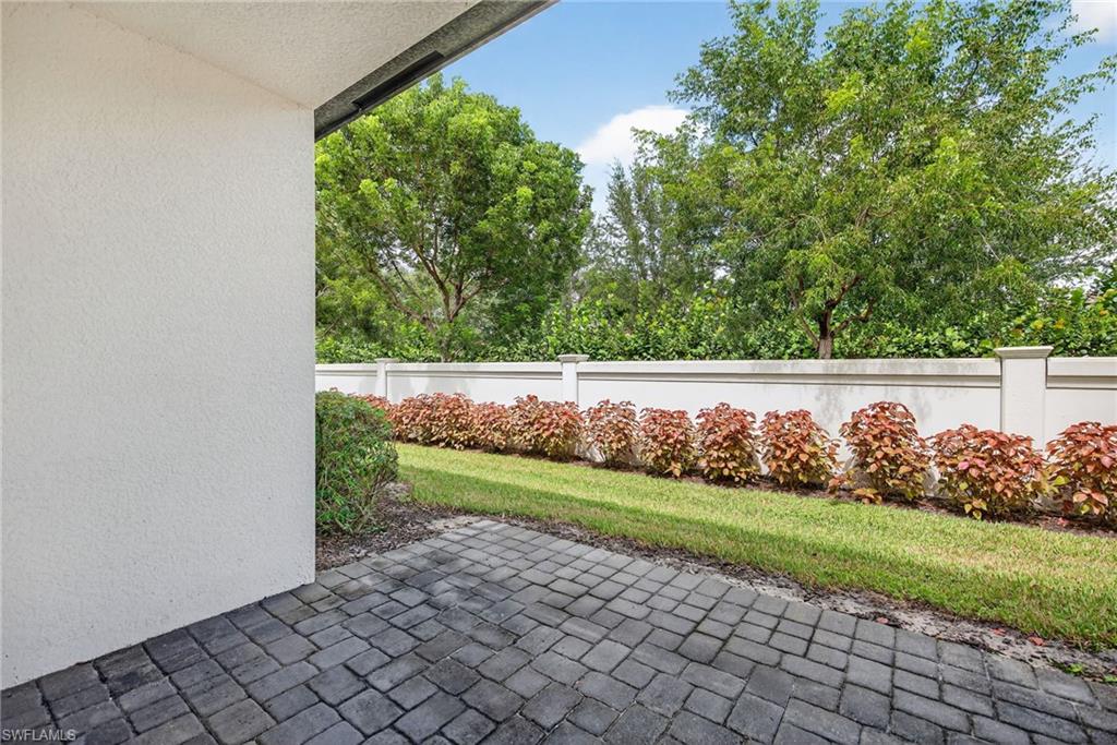 7570 Rockefeller Drive Naples, FL 34119 - Photo 28 of 34 a view of a yard with wooden fence