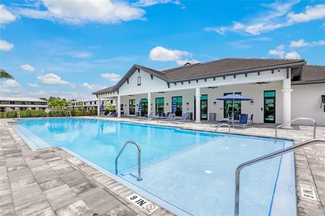 a view of a swimming pool and lounge chair