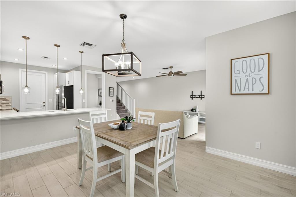 7570 Rockefeller Drive Naples, FL 34119 - Photo 8 of 34 a view of a dining room with furniture