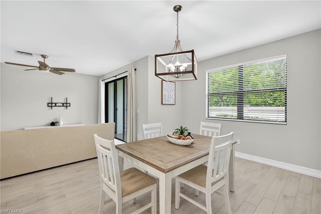 7570 Rockefeller Drive Naples, FL 34119 - Photo 10 of 34 a living room with furniture and a window