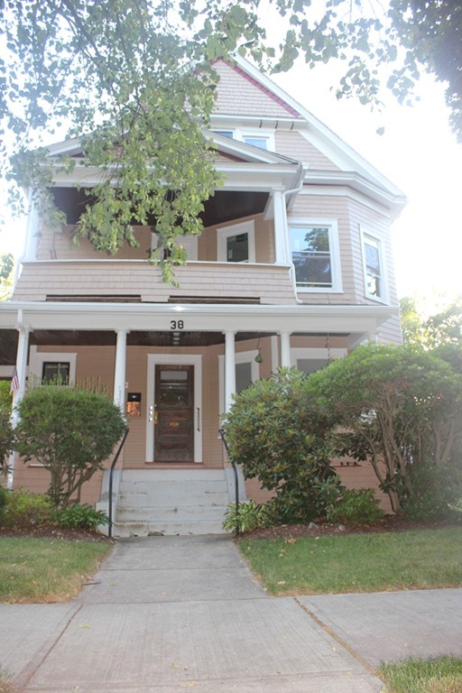 38 Washington Road Springfield, MA 01108 - Photo 1 of 14 a front view of a house with yard and garage