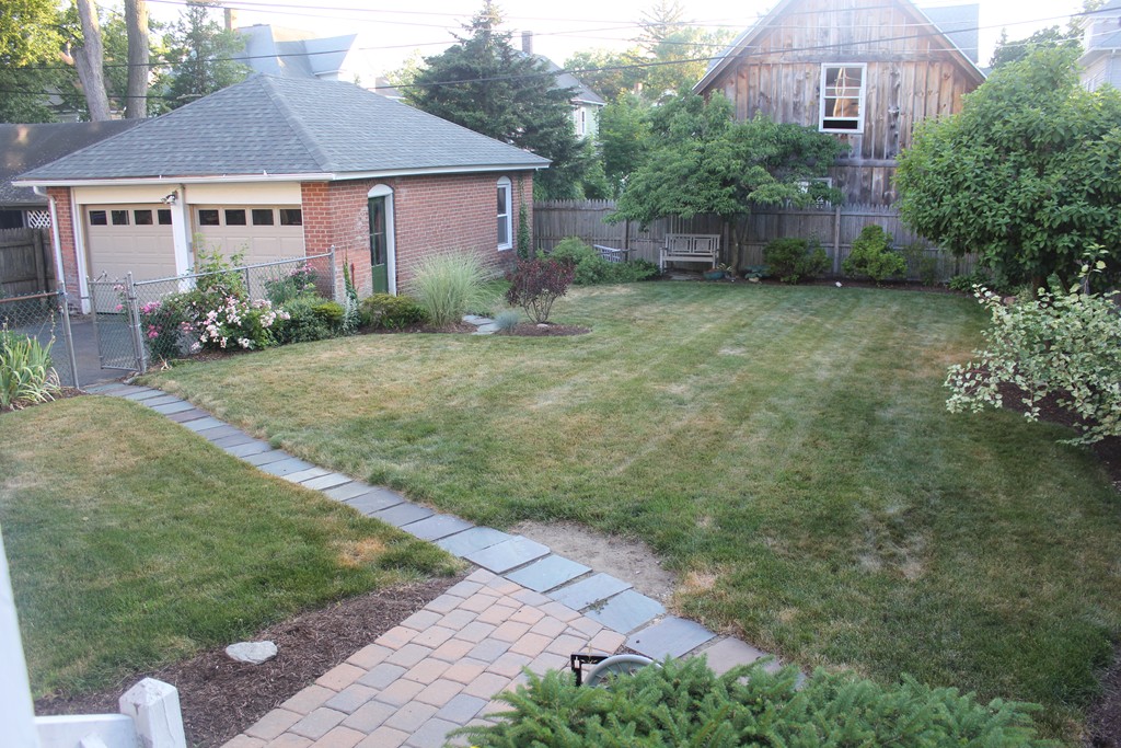 38 Washington Road Springfield, MA 01108 - Photo 5 of 14 a view of a house with a yard and plants