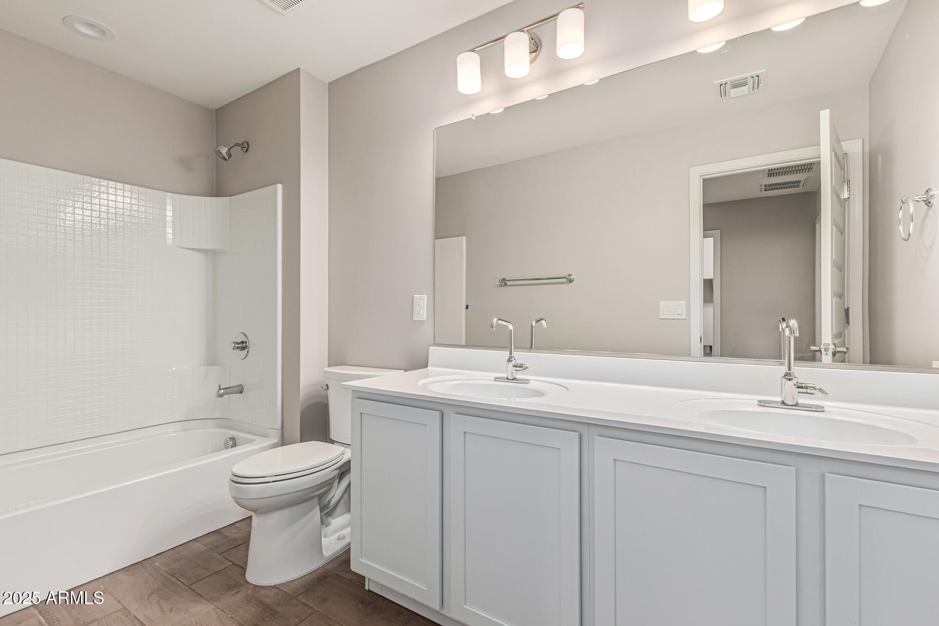 733 East Commonwealth Avenue, Unit 36 Chandler, AZ 85225 - Photo 23 of 30 a bathroom with a sink a toilet and shower