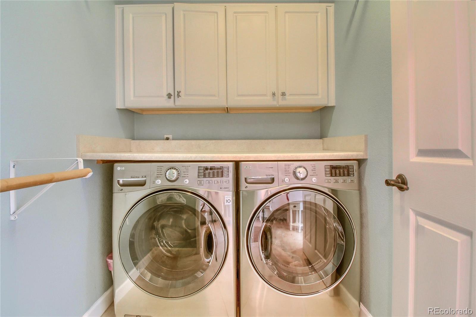 8952 Tuscany Lane Highlands Ranch, CO 80130 - Photo 14 of 32 a utility room with dryer and washer