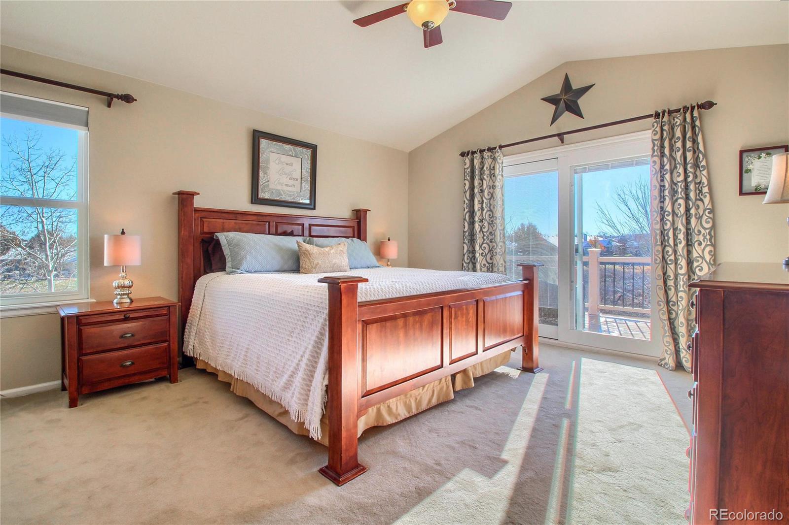 8952 Tuscany Lane Highlands Ranch, CO 80130 - Photo 16 of 32 a bedroom with a bed dresser and a window